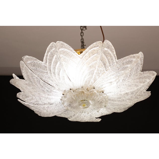 Splendid Murano glass ceiling lamp. Period: circa 1970. The ceiling light misure 35 cm in height, the diameter measures 75...