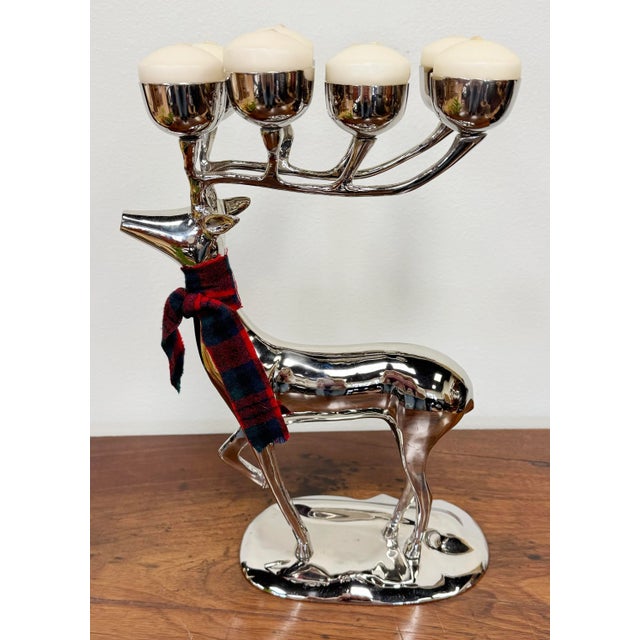 Sleek polished ten point stag deer candelabra on stand. Features large antler rack with 10 candleholders. Tartan scarf is...