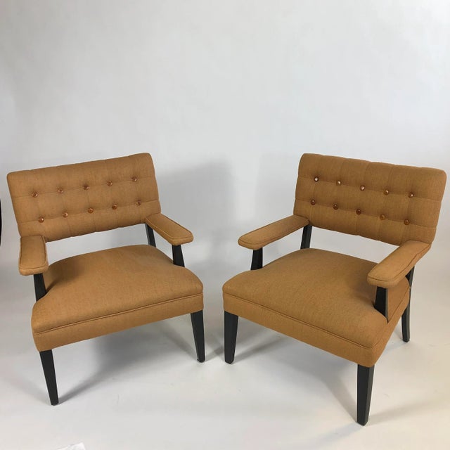 Pair of tufted WIlliam "Billy" Haines-style chairs, in textured fabric, with horn buttons and black lacquered frames.