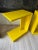 Pair of vintage C.2010 CB2 lacquered bright yellow side tables with wheels. Solid structure. Heavy weight.