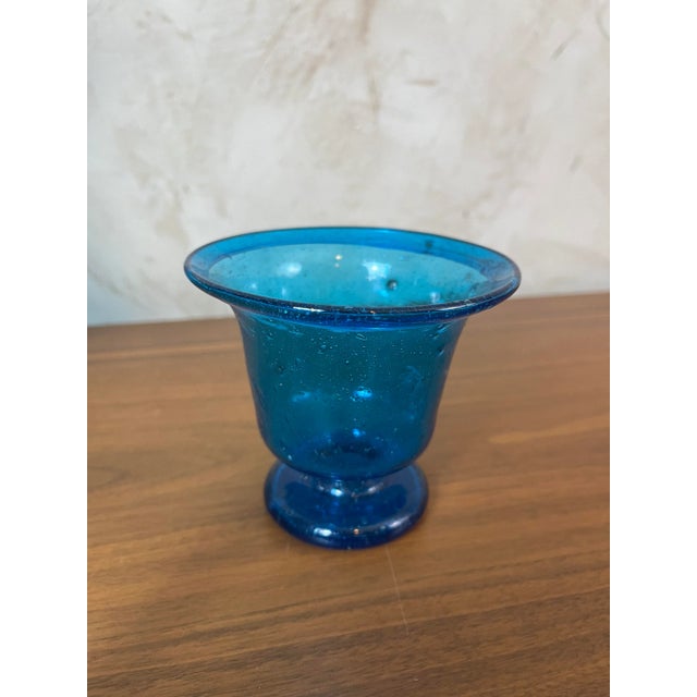 BIOT-style blown glass bowl. Its intense blue, with variations in shade that beautifully capture the light, and its...