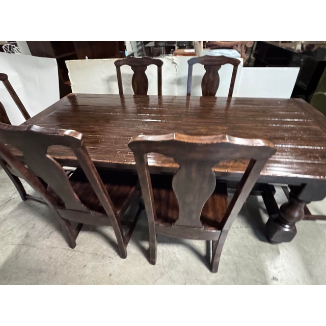 Design Plus Gallery presents a Rich Brown Finish Cortona Extension Dining Table and Set of Six Side Chairs by Pottery...