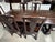 Design Plus Gallery presents a Rich Brown Finish Cortona Extension Dining Table and Set of Six Side Chairs by Pottery...