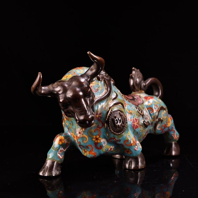 This is a cast bronze figurine of a standing ox or water buffalo, featuring intricate cloisonné enamel and gilt bronze...