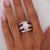 A GIA-certified 4.43 carat oval brilliant diamond in G color and I1 clarity is four-prong set in a platinum 900 wide dome...