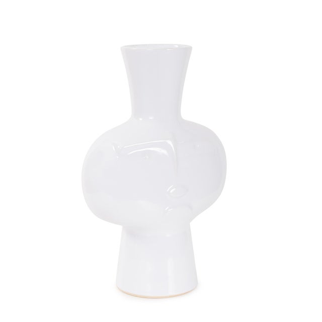 Featuring a stylized abstract face in a glossy white ceramic finish. Whether used to showcase fresh florals or styled as a...