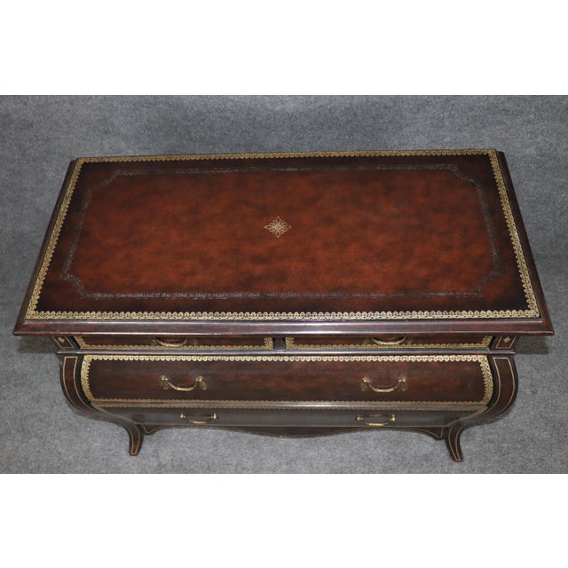 This exceptional pair of Maitland-Smith leather wrapped bombe commodes represents the finest traditions of luxury...