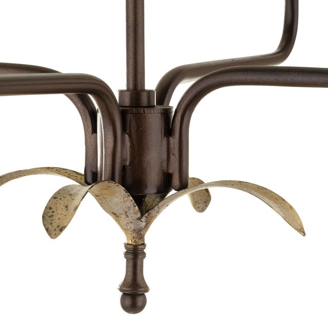 The Ava 4-Light Chandelier features simple, elegant lines with detailed leaf accents. Customize with contrasting finishes...