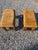 A pair of 1970’s Drexel Heritage suede parsons stools/ottomans in a golden tan color. Parson style frame with rolling...