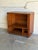 This compact cabinet features smooth tambour doors that disappear seamlessly into a softly rounded frame. Set upon rolling...