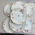 These antique Haviland Limoges porcelain plates feature a scalloped gold-gilt rim and a delicate pink and purple floral...