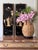 Presenting a vintage large scale natural sea grass cache pot in pineapple form with Asian motif carved wood plinth and...