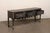 An English Jacobean style oak console table from the turn of the 18th and 19th century. This antique table from England...