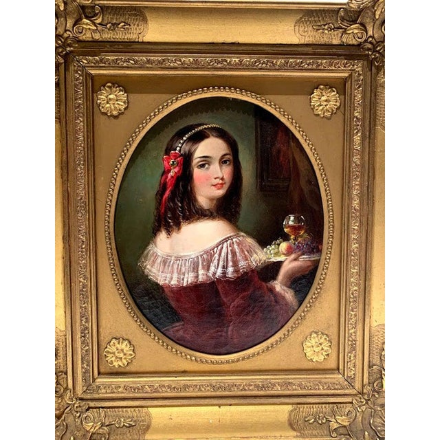 Mid-19th-century oil on canvas, "Holding the Keys" of a girl holding a plate of fruit and wine in a beautiful gilded...
