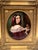 Mid-19th-century oil on canvas, "Holding the Keys" of a girl holding a plate of fruit and wine in a beautiful gilded...