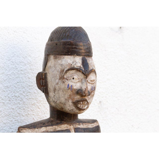This 25-inch carved figure is a significant example of the sculptural heritage of the Idoma people from the lower Benue...