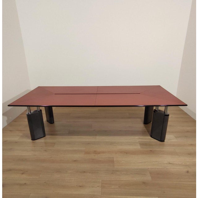 Large and rare table/desk with a leather-covered top. Kum model, designed by Gae Aulenti for Tecno. Italy, 1980s....