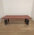 Large and rare table/desk with a leather-covered top. Kum model, designed by Gae Aulenti for Tecno. Italy, 1980s....