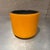 For your consideration, a vintage Mid Century Modern style vessel featuring a vibrant orange glaze and a contrasting black...