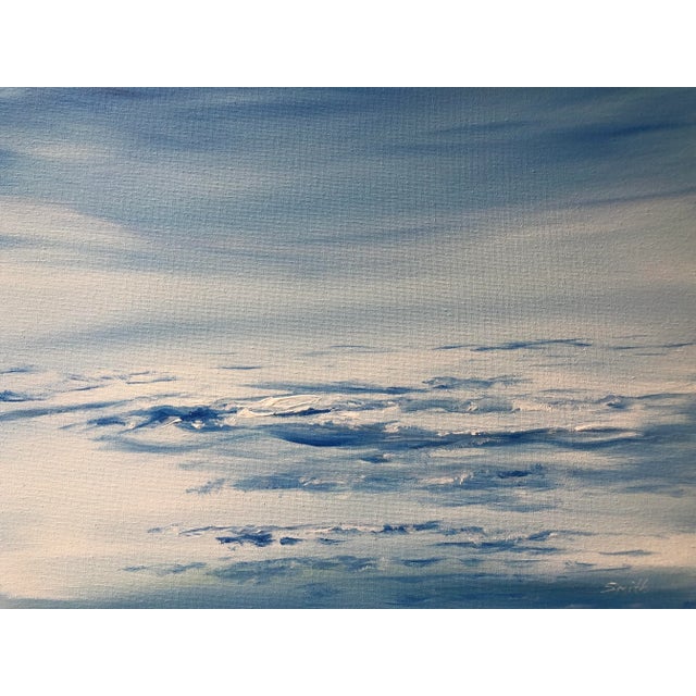 A monochromatic rendering of the sea on a bright blue day under a swath of cobalt sky. Signed and ready to frame.