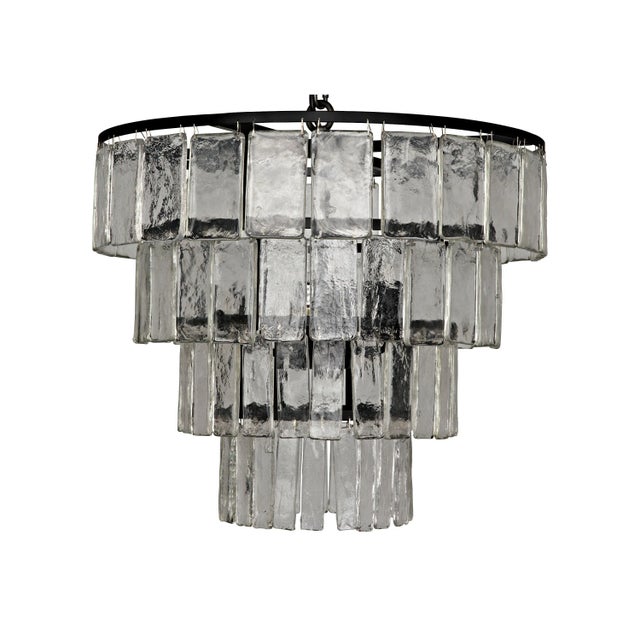 Glass paillettes drip ostentatiously down the outside of this stunning, sparkling chandelier. Bulb Quantity: 4 Socket: E12...