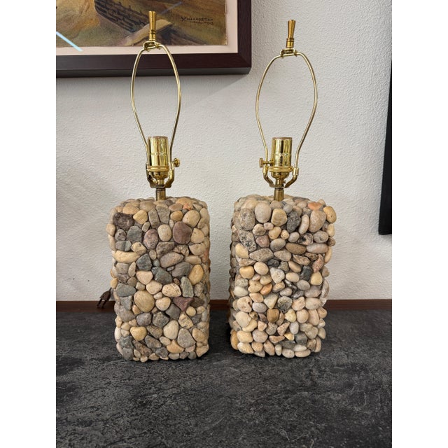 A pretty pair of hand crafted river stone lamps with new brass fittings. These lamps are quite beautiful and each is...