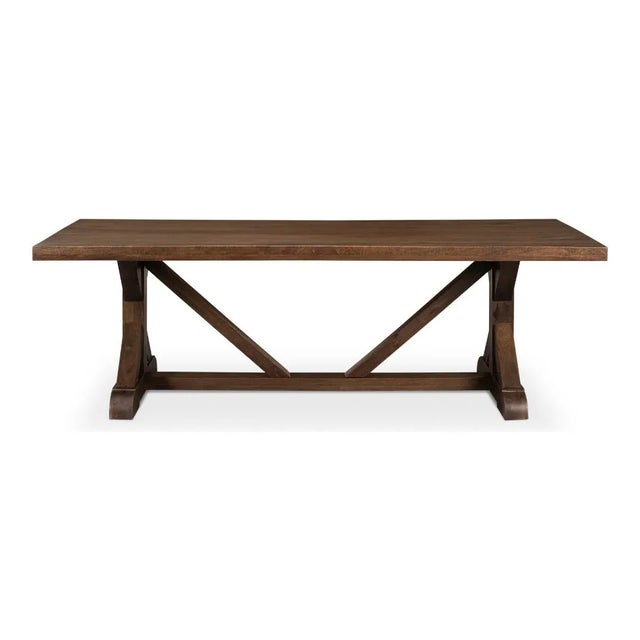 Farmhouse Refectory Dining Table is constructed of reclaimed wood in a walnut finish, with trestle end supports and a...