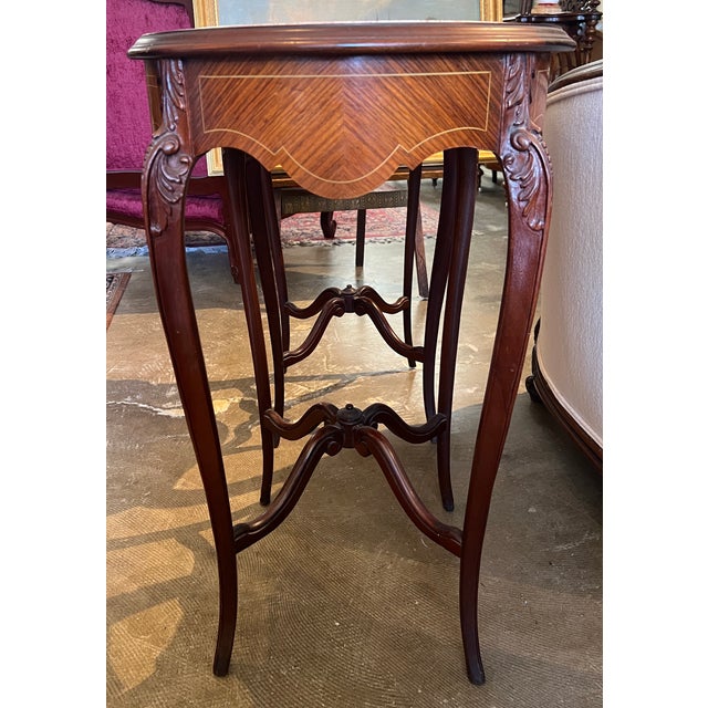 Beautiful carved walnut side tables with marble tops. 18"w x 28.25"h