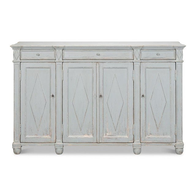 Weathered paint gives the case the relaxed character of furniture long at home near the coast. Three drawers across the...