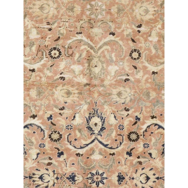 This mid-20th-century Turkish Anatolian accent rug presents an intricate allover floral composition across a softly muted...