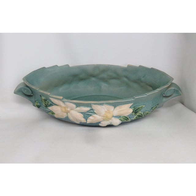 This gorgeous console bowl is made out of ceramic, and it is in good condition. This lovely bowl was made by Roseville, a...
