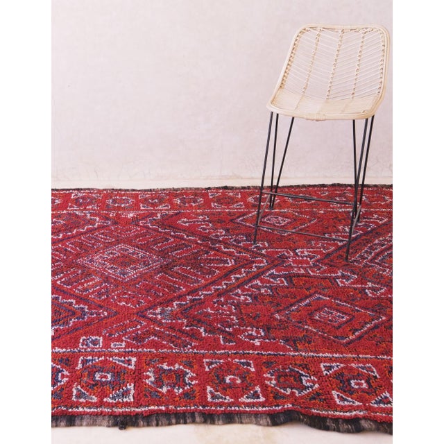 This vintage Beni M’Guild rug from Morocco’s Middle Atlas Mountains showcases traditional craftsmanship through its bold,...