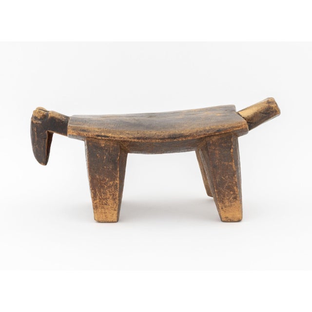 Lobi Burkino Faso Zoomorphic Carved Wood Stool, with herd animal head and tail. 9" H x 20.5" W x 9" D. Provenance: From a...