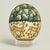 Transporting vintage Moroccan ostrich egg hand decorated with figures, animals and trees executed in classic Moorish style...