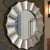 A large 41 silver-leaved modern wall mirror that's effective for adding a striking glam Hollywood Regency accent to your...