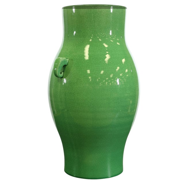 A large baluster vase in a green glaze with two handles by Bitossi Italy.