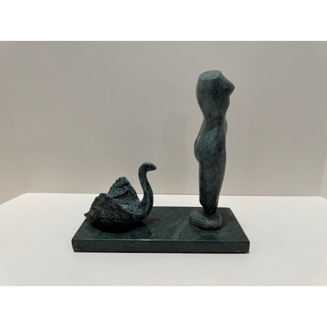 Original signed sculpture by Larry Mohr, featuring a stylized standing female figure paired with an abstract organic form,...