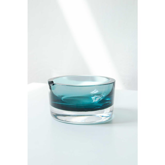 Stunning vintage blue crystal ashtray, engraved and stamped on the base. An elegant and refined piece, crafted from thick,...