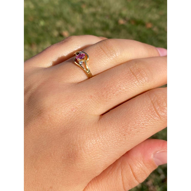 Cinco Calle: Pink Sapphire and Natural Diamond Ring in Yellow Gold. Our exquisite ring features a vibrant oval brilliant...