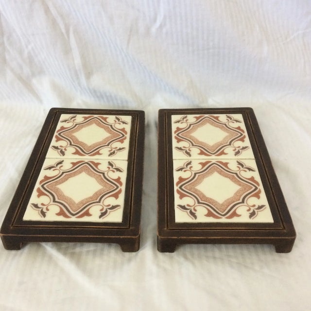 Nice pair of brown Mexican tile trivets set in walnut stained pine. If these brown Mexican 1970’s trivets don’t scream...