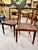 This is a very good set of 6 English Regency solid mahogany side or dining chairs of a modified klismos form. The chairs...