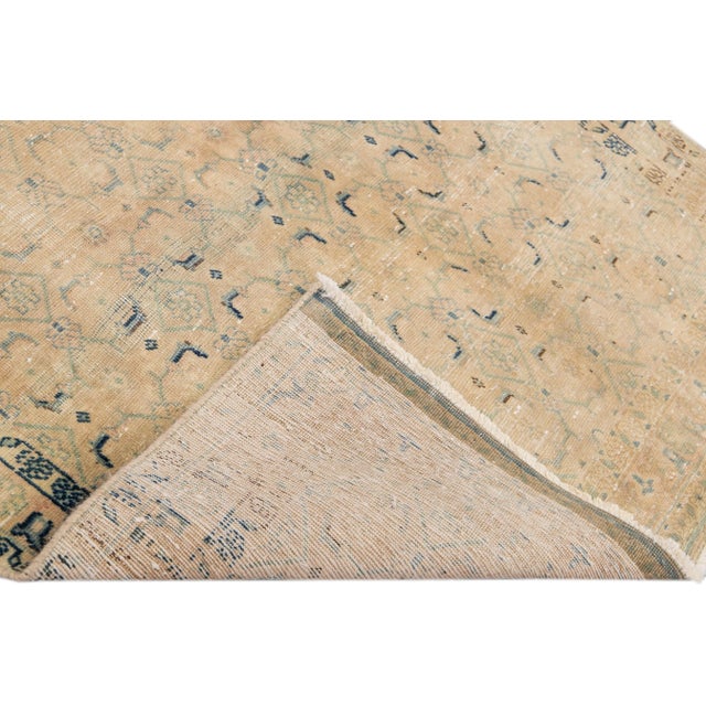 Beautiful Vintage Geometric hand-knotted wool runner with a beige field. This runner has blue accents all-over a geometric...