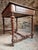 Old French writing table dating from approximately the 1930s, crafted from walnut. This compact piece features a single...