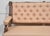 A finely proportioned upholstered settee, featuring a richly figured walnut frame with turned supports and gently scrolled...