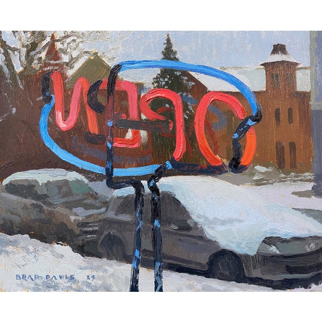 The painting depicts a vibrant, abstract sculpture against a snowy urban backdrop, where the bold colors of red and blue...