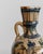 This antique 18th century ceramic vase is a delicate handcrafted piece from the Near East, featuring a beautifully hand-...