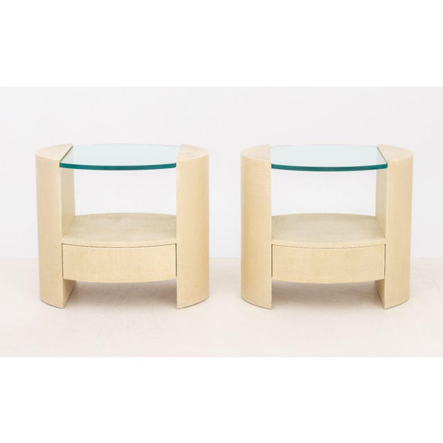 Pair of Jay Spectre Style Modern Grasscloth Textured Bedside Tables, with glass tops. 24.25" H x 28.25" W x 20.25" D....
