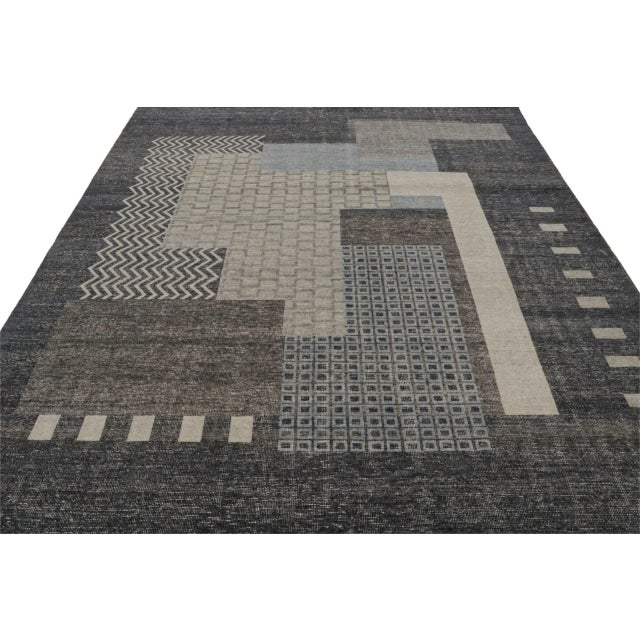 Hand-knotted in wool, this 8x10 modern rug, has been inspired by French Art Deco rugs and similar cubist sensibilities of...