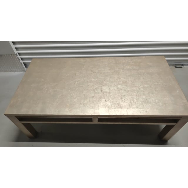 Exceptional contemporary rectangular cocktail table from the luxury Baker Luxe collection. Features a striking handcrafted...
