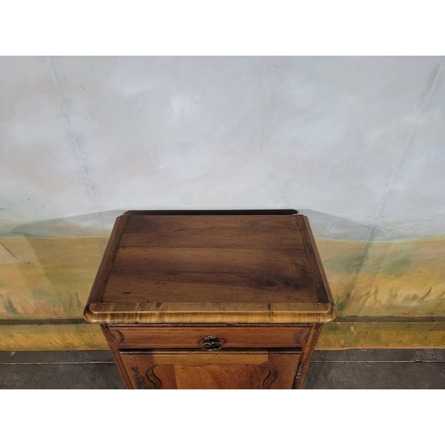 Charming antique jam cupboard in solid walnut, with a rustic yet elegant style. This small accent piece boasts a...
